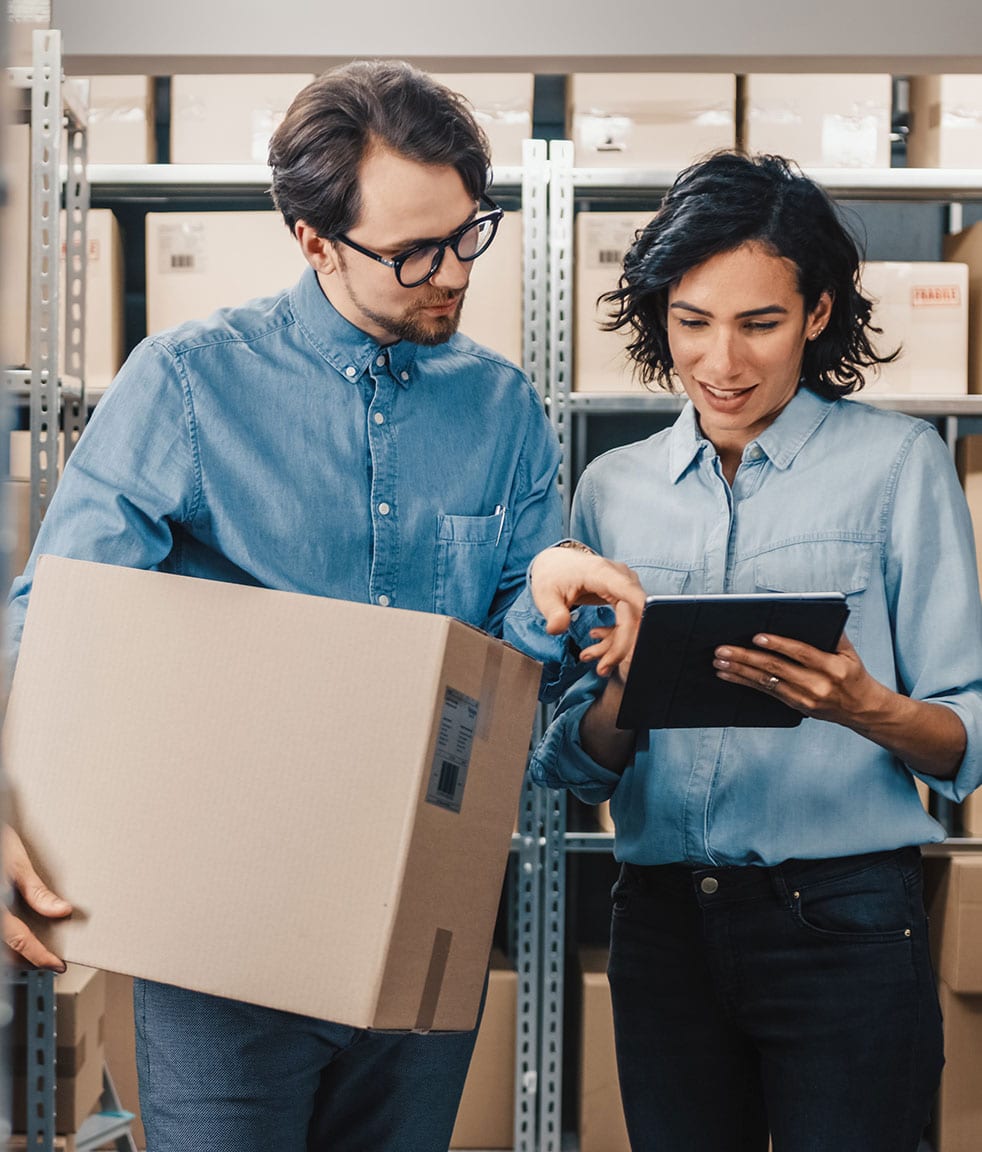 images warehouse employees holding boxes checking stock 2